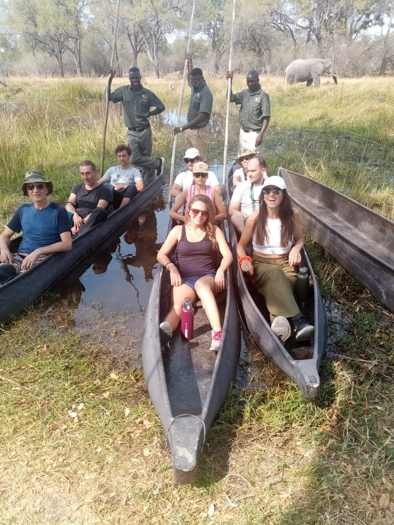 Guests boarding mokoro canoes, Okavango Delta